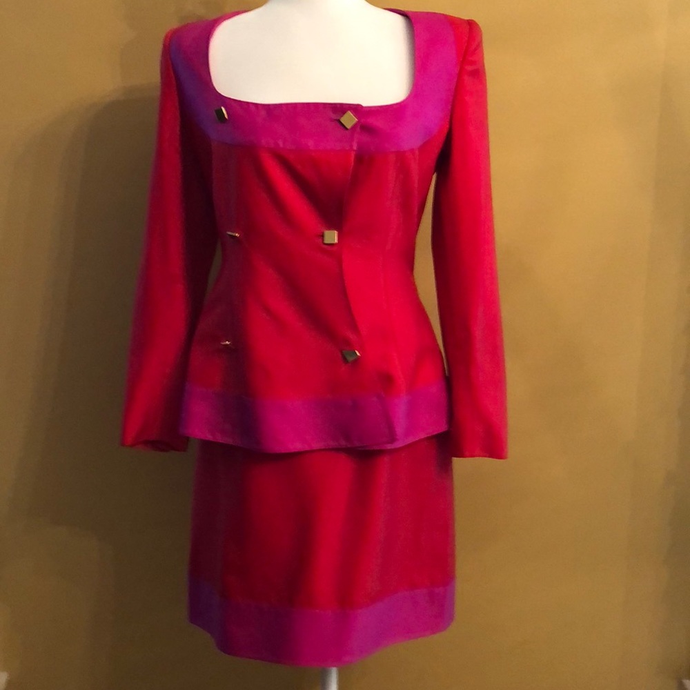 Skirt and jacket suit with square brass buttons